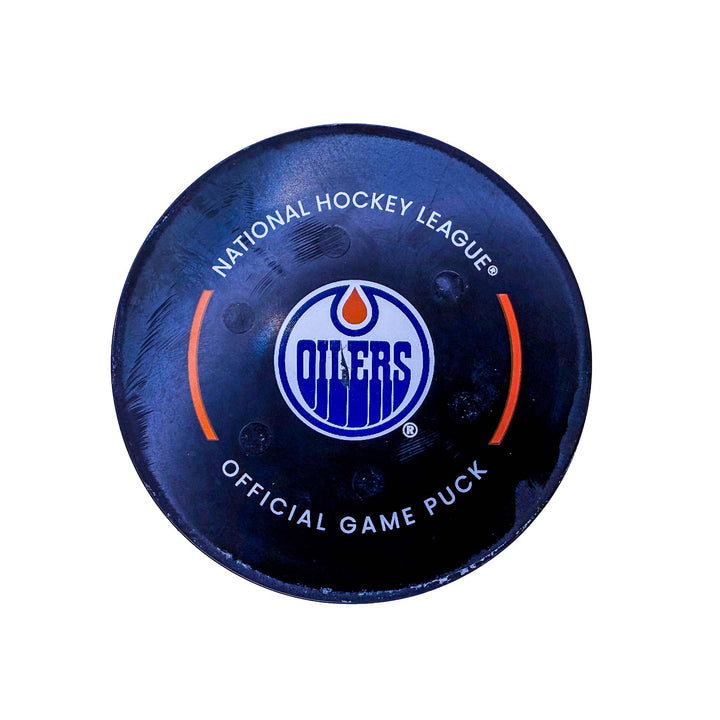 Rasmus Andersson Calgary Flames Goal Puck - Oct. 13/2024 vs Edmonton Oilers #24887